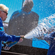 Virgin Galactic founder Richard Branson spraying champagne onto crew member Beth Moses after their flight to space.
